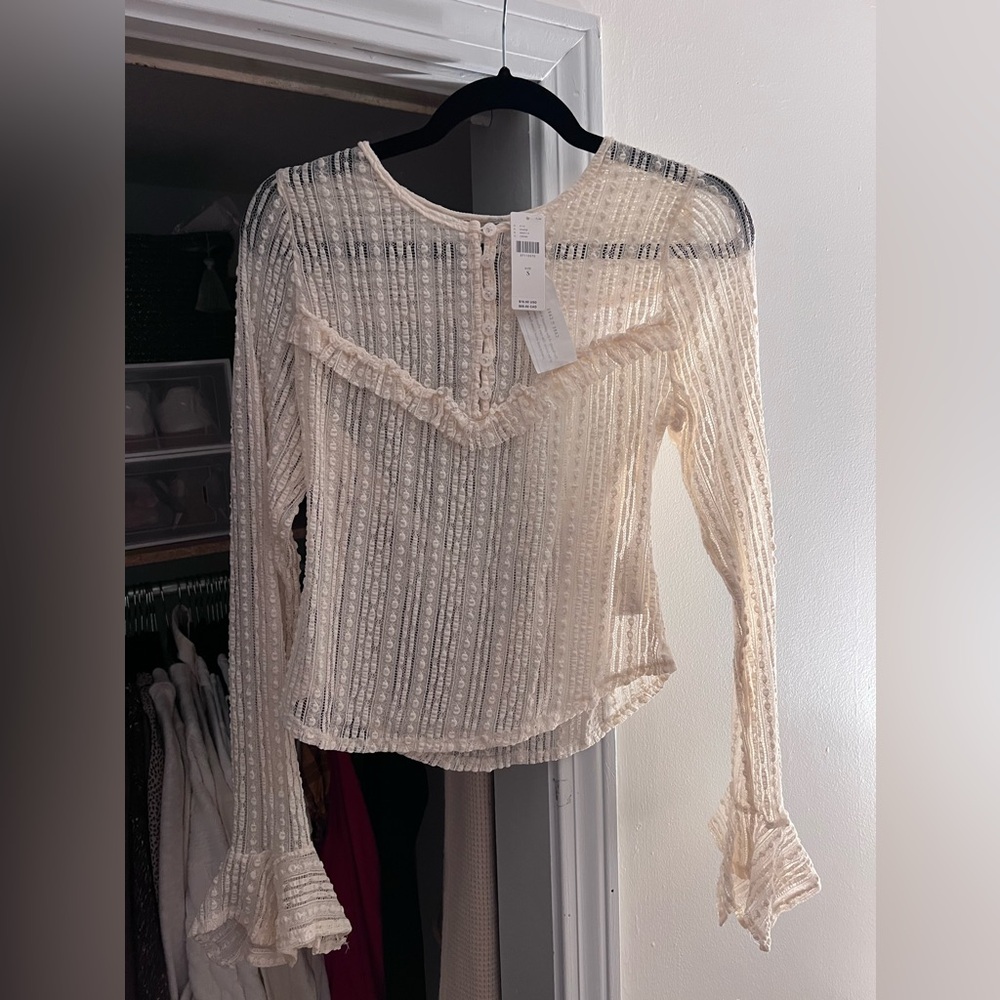 Perfectly new with tags long sleeve from anthropologie.